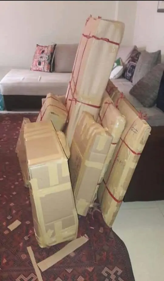 Expert Movers Dubai crew packing furniture carefully